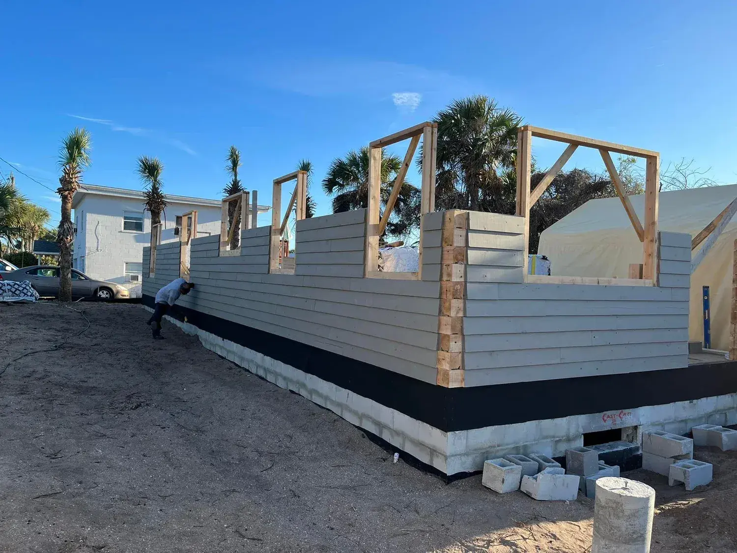 Solid cedar walls going up on a coastal foundation
