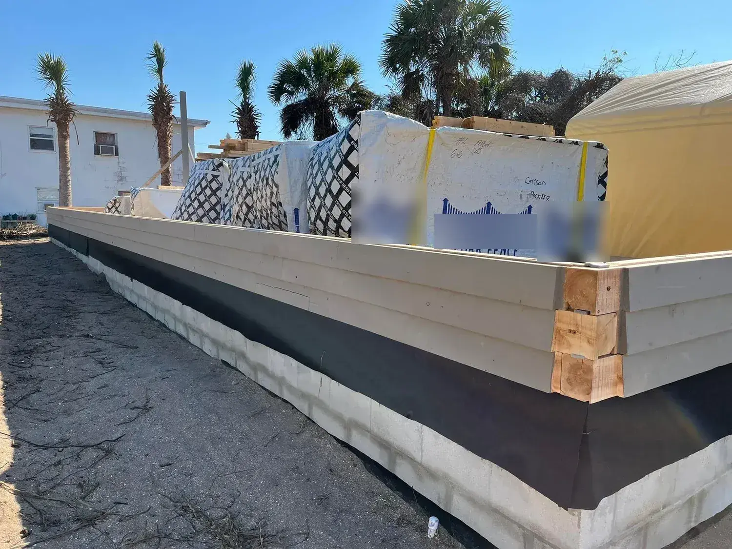Solid cedar wall courses during construction