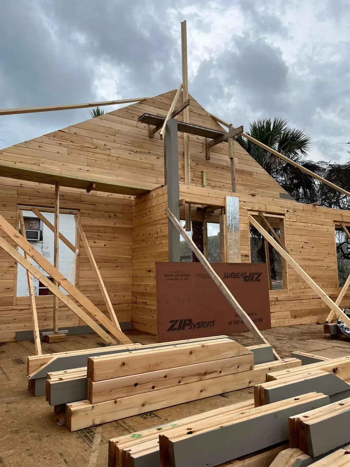 Cedar wall system and timber framing during construction