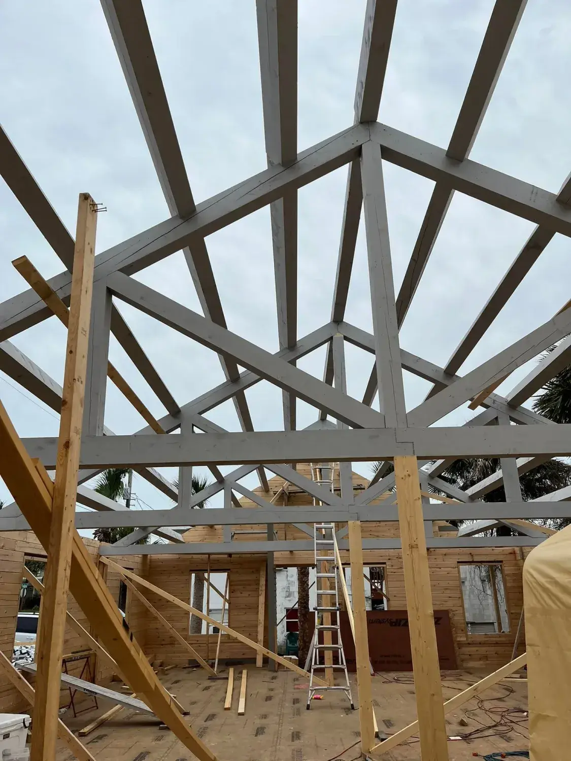 Roof trusses viewed from the cedar walls