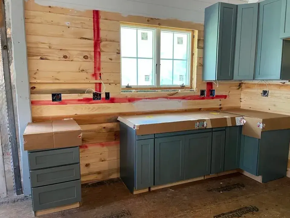 Kitchen base cabinets being installed
