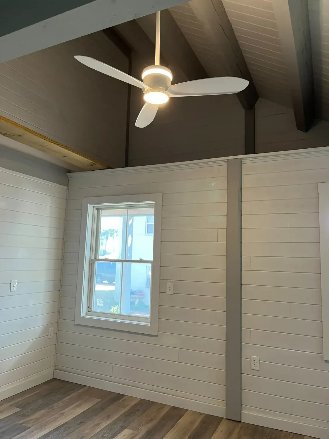 Bedroom with ceiling fan and window
