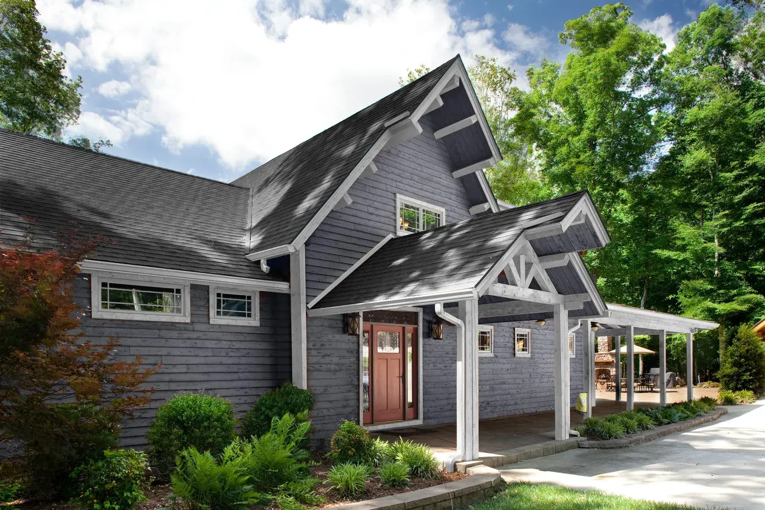 Craftsman-style cedar home exterior with covered entry