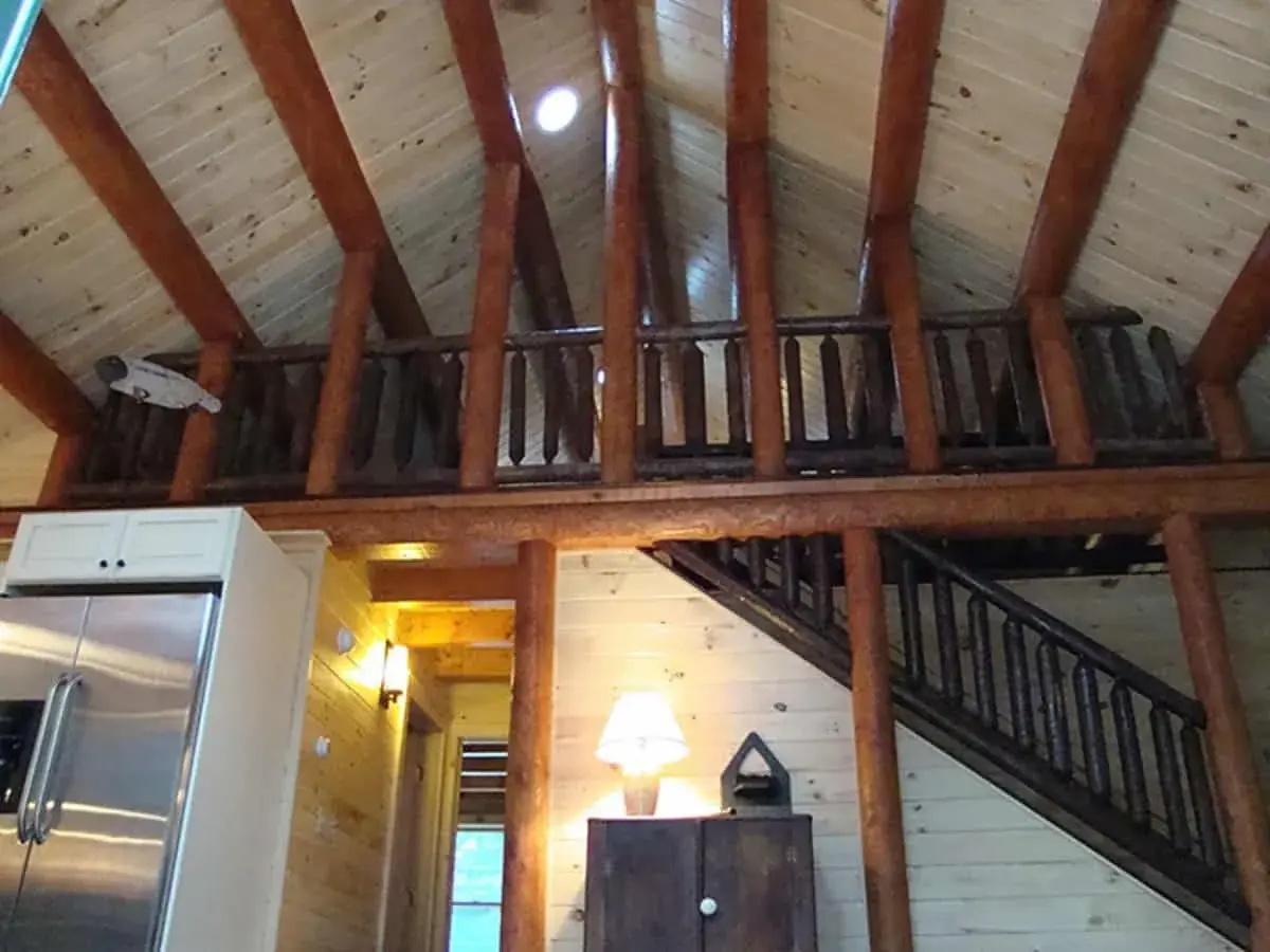 A view of the loft in this log cabin home.