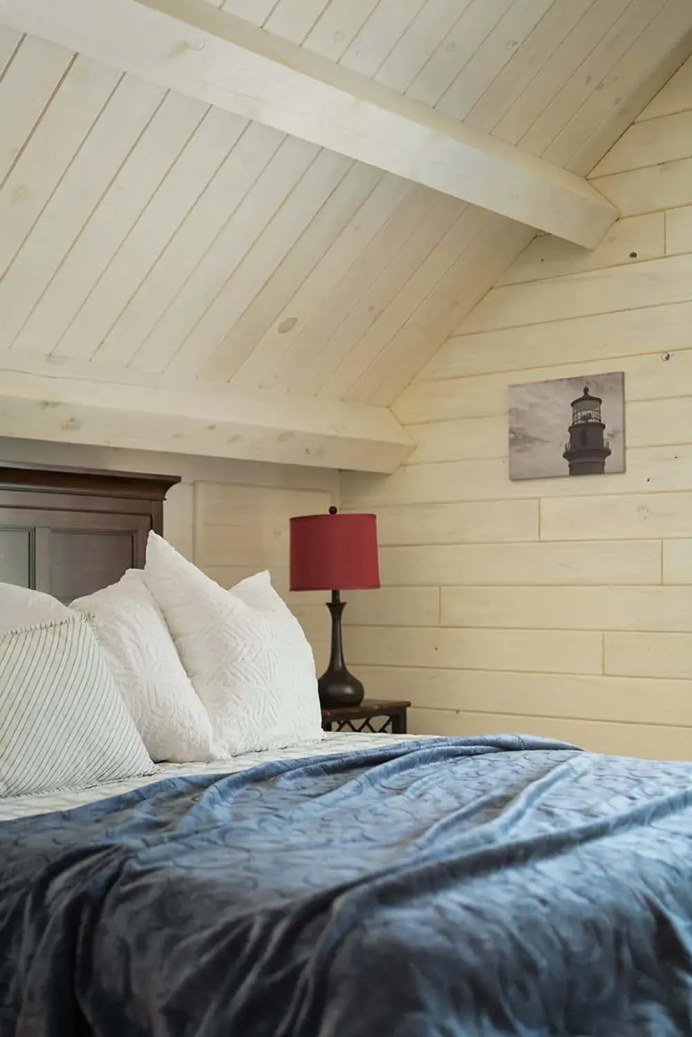 Exposed wood beams give this bedroom a cozy feel.