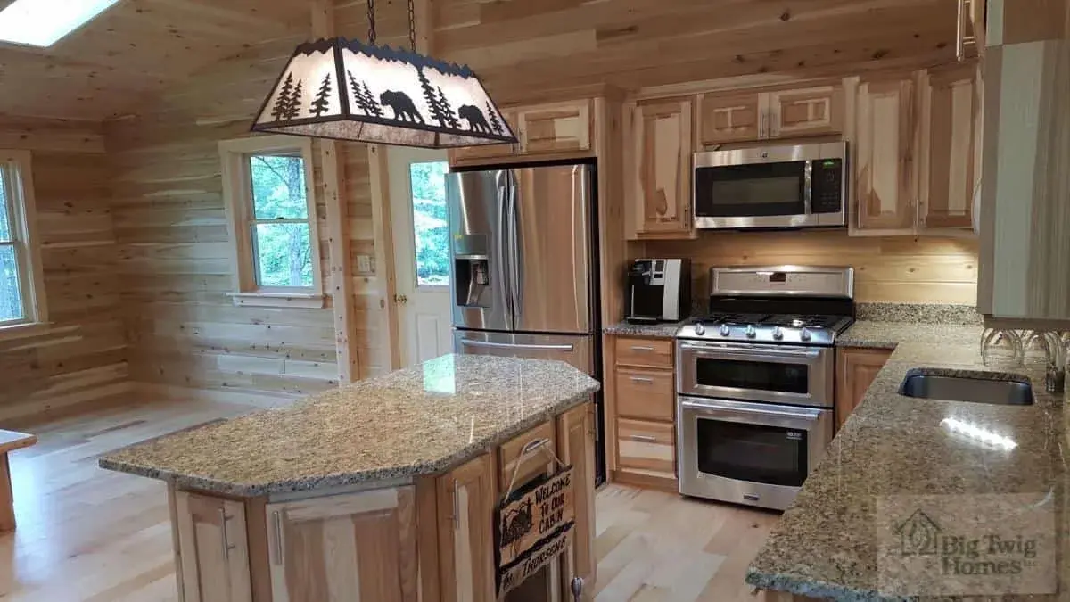 A beautiful custom kitchen in a log home built by Big Twig Homes.