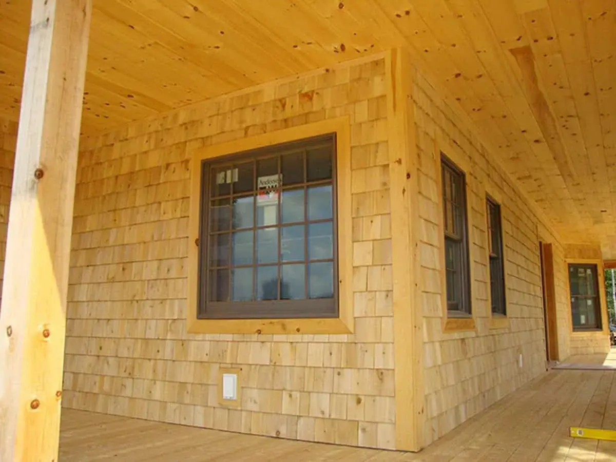 A closeup image of cedar shingle siding.