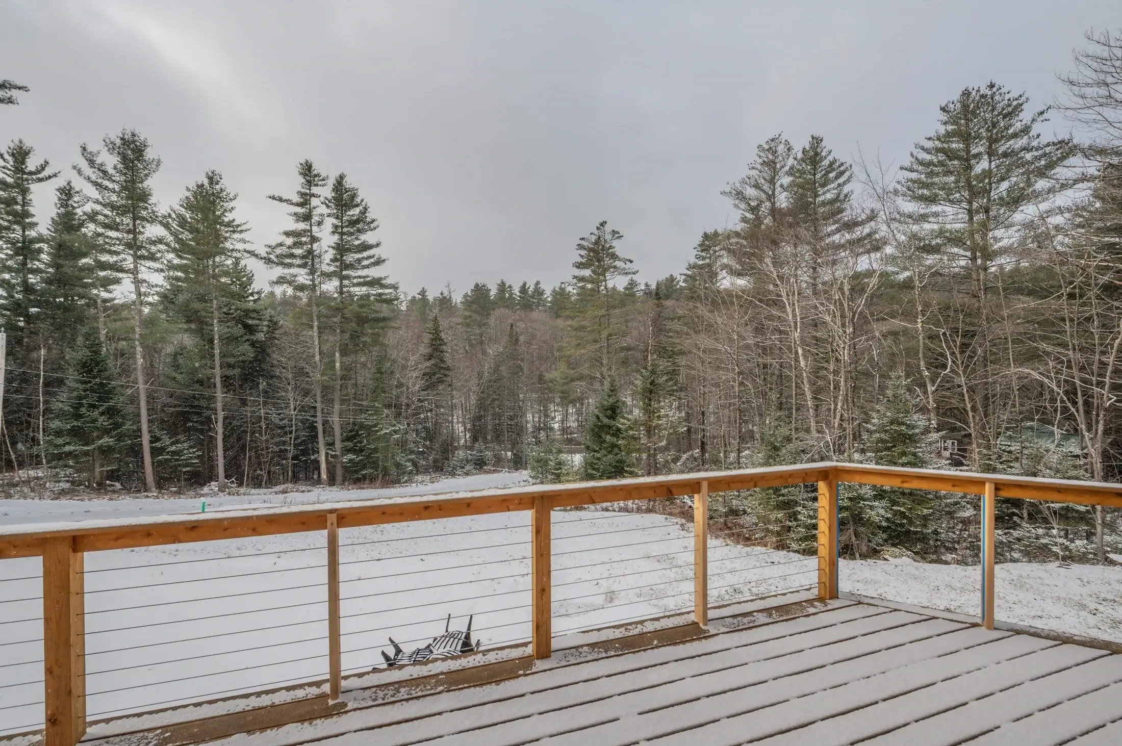Cable railing on a deck is a great way to make a log home feel more modern, and it allows a full sight line for maximum views. 
