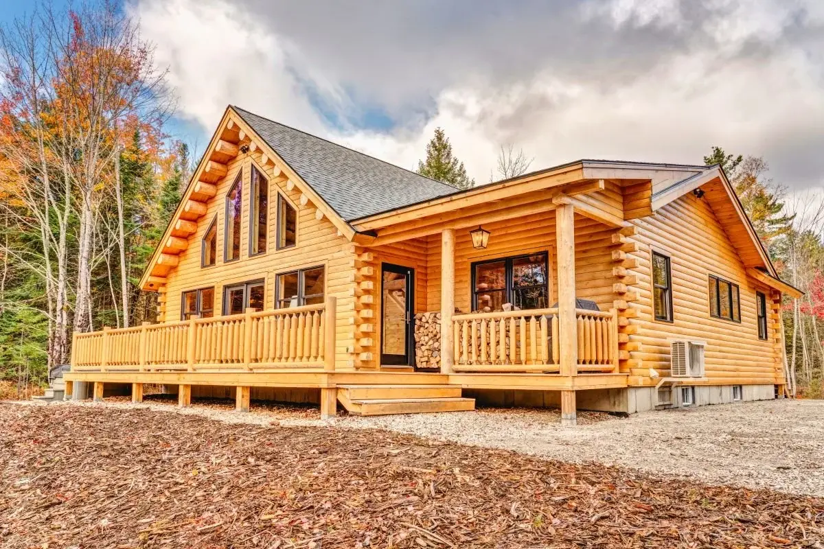 The spacious deck off the great room is ideal for outdoor entertaining, and the covered side porch is perfect for keeping the rain off the  firewood and grill. Floor to ceiling windows take in the views and let in the light. 