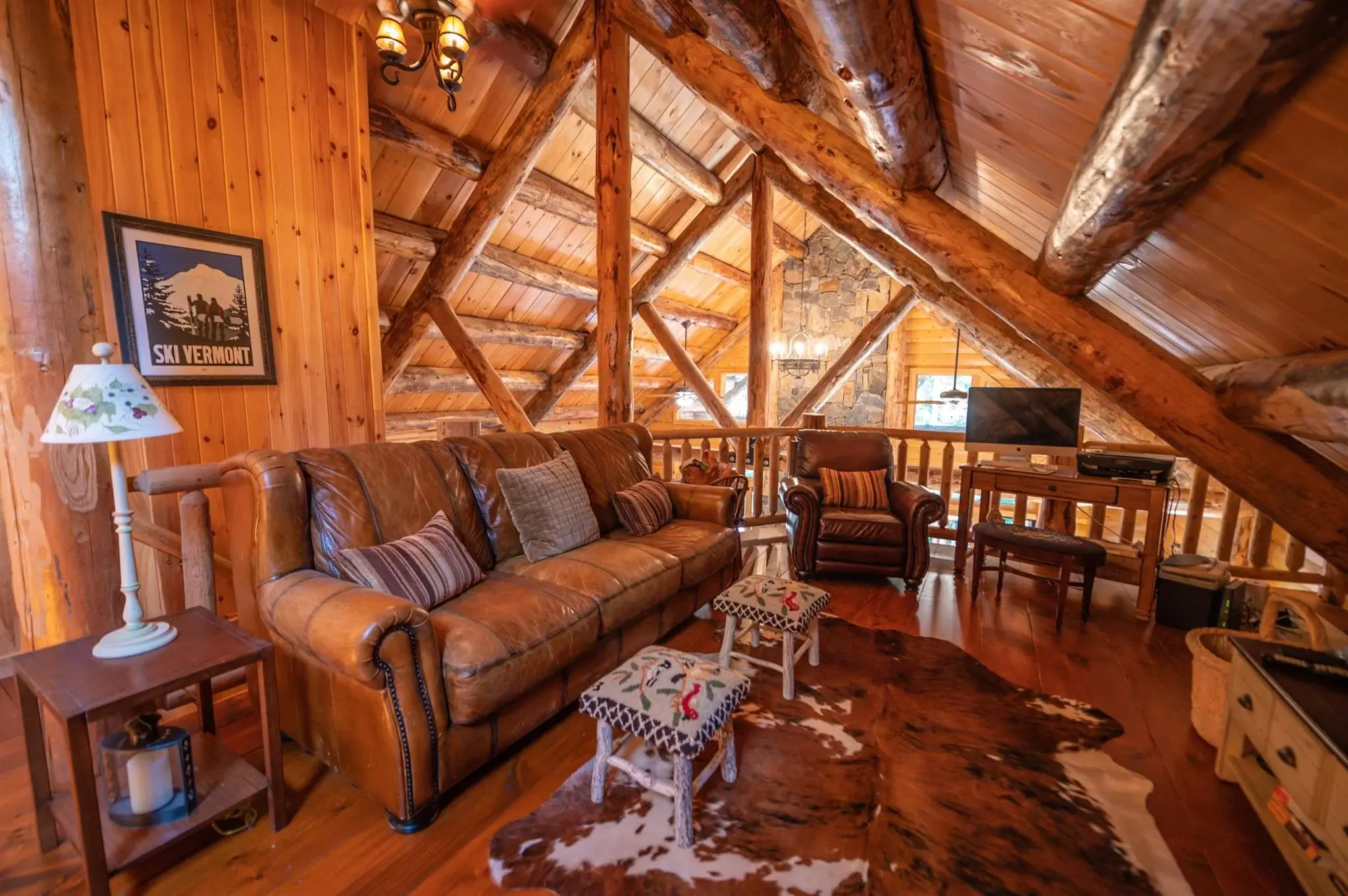 Loft space is maximized with an angled rail, allowing room for a full sitting area as well as a home office. 