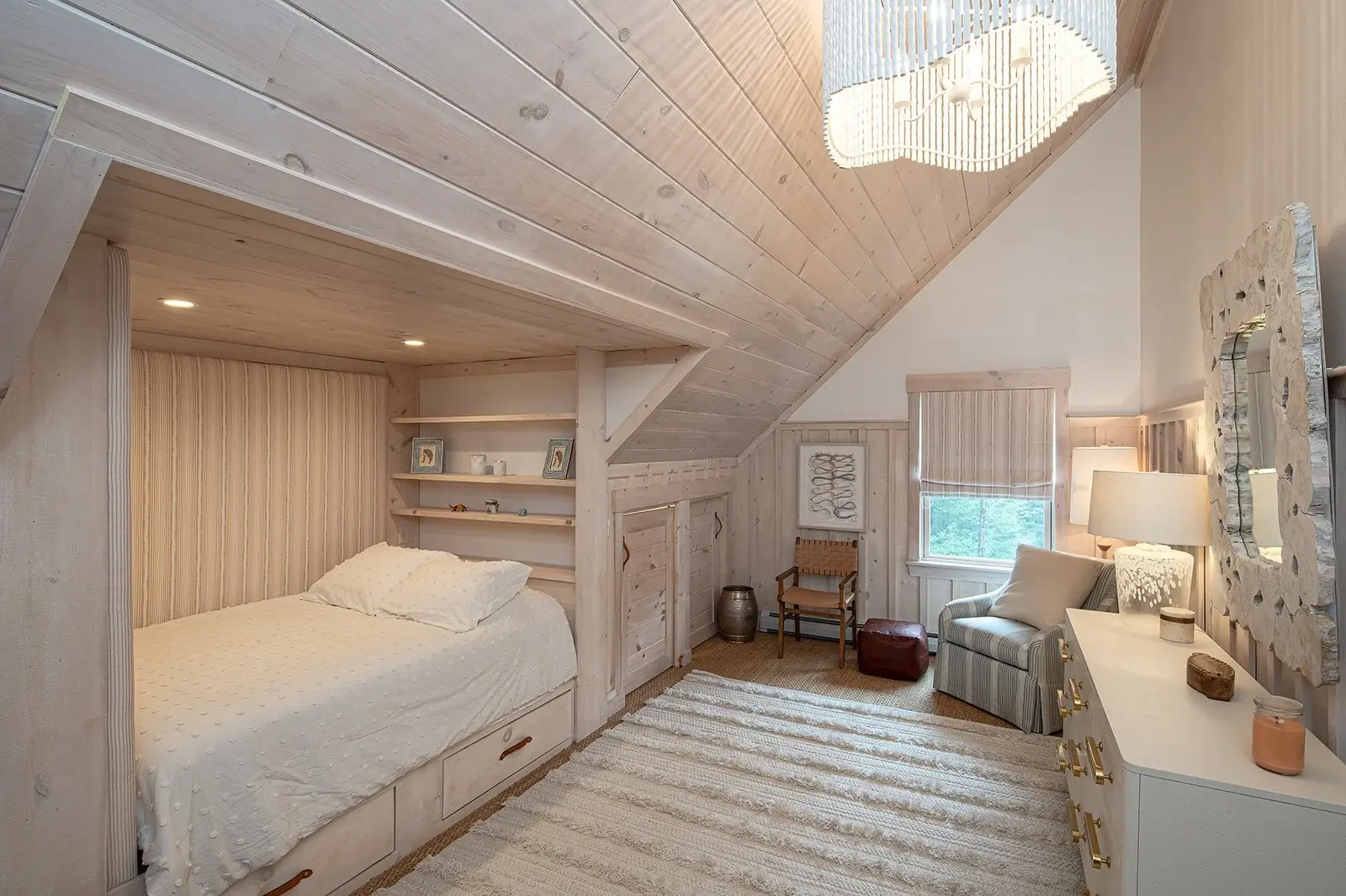 This ethereal bedroom is another example of how layering textures in light neutral tones results in beautifully well-appointed space. Adding built-in storage and a cozy bed nook are simple customizations that really upgrade a home.