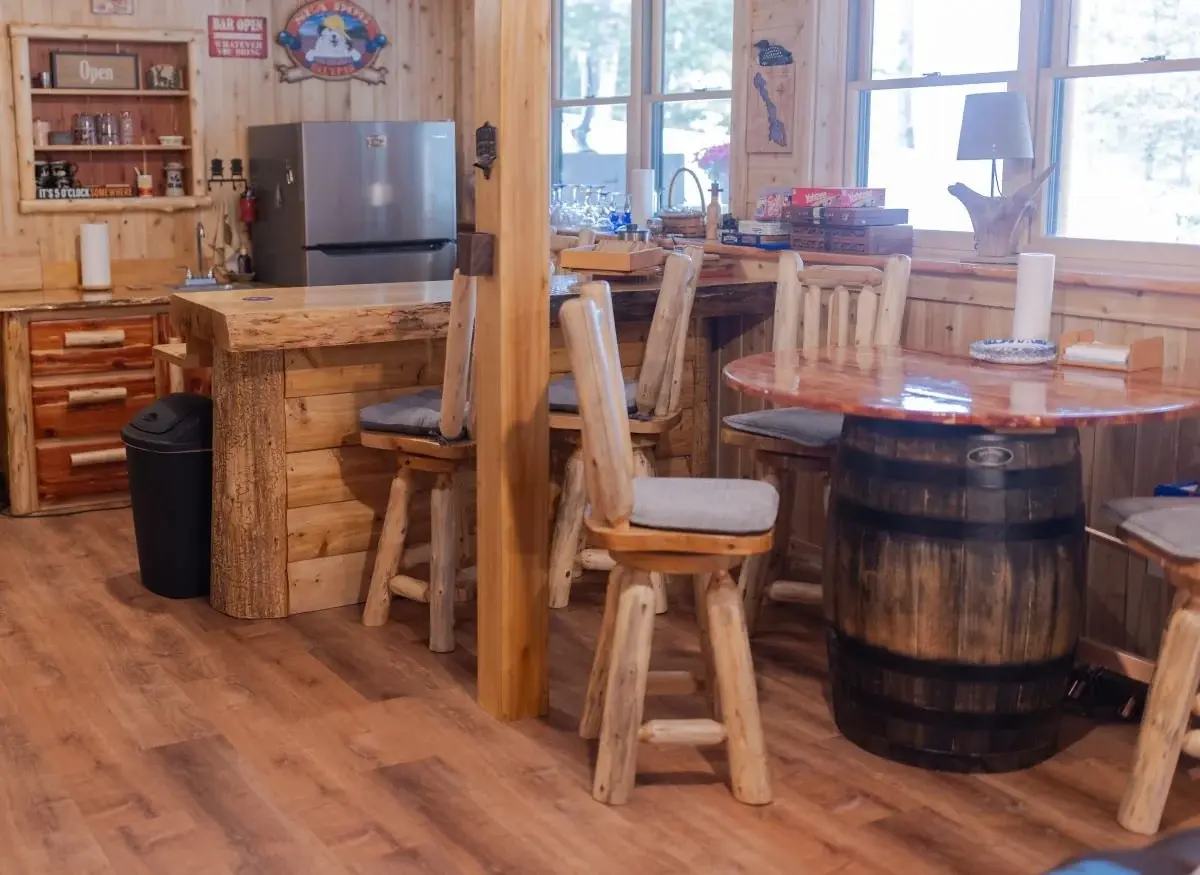 Bespoke wooden furnishings evoke the style of a classic fishing lodge in the ground floor bar. 