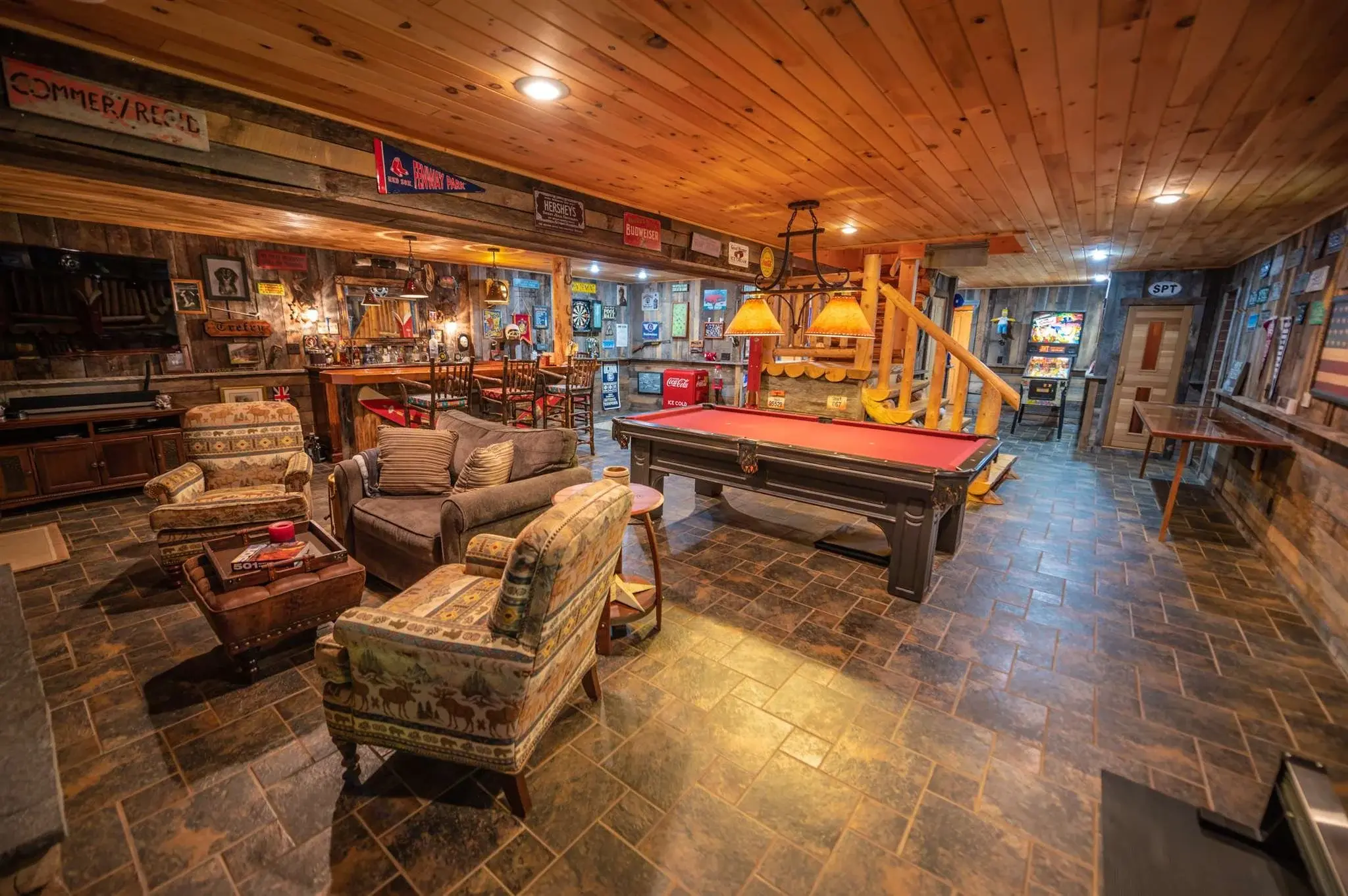 The game room is the ultimate spot for entertaining. Slate floor tiles, durable fabrics, and high gloss wood finishes will clean up easily and wear well over time. 