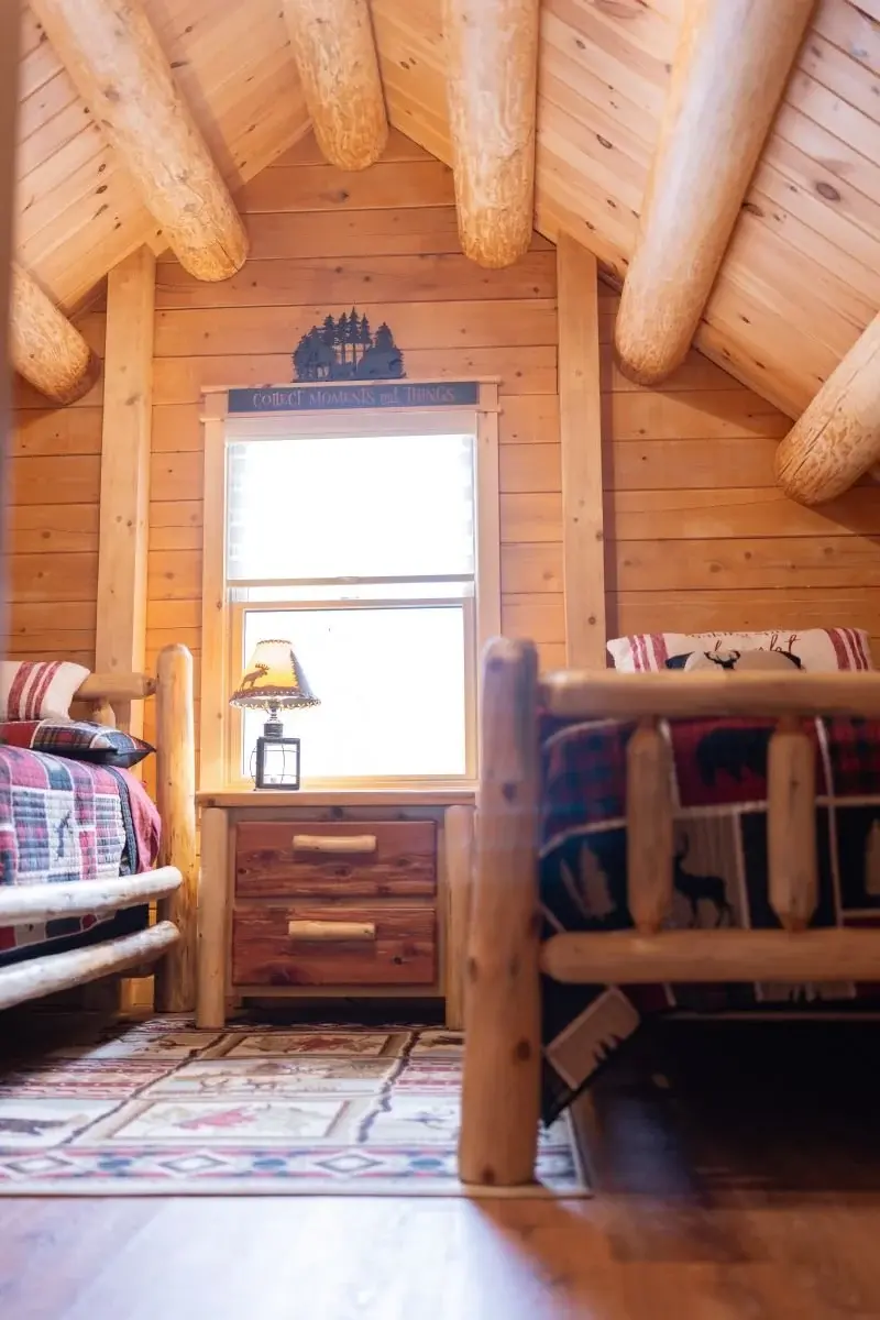 A large central window lets in plenty of sunshine, while solid cedar beams frame the ceiling. 