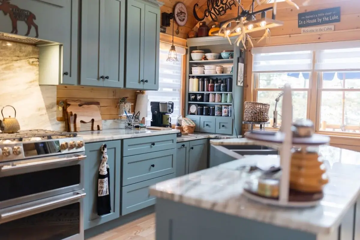 Custom cabinetry allows for personalized storage, like this dedicated coffee bar. Flooded with natural light and practically designed for easy access, it’s the perfect way to start the day. 