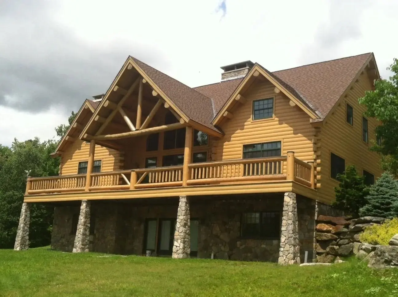 moosehead_exterior_stone_supports_gable_porch_daylight_basement.webp