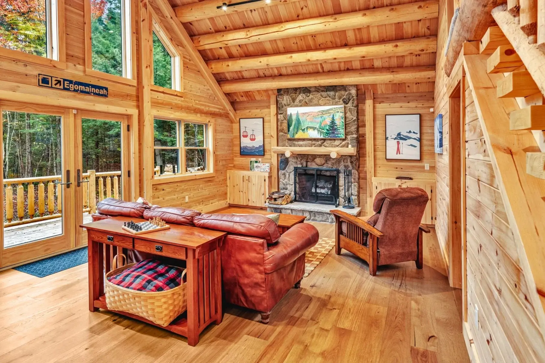 With soaring windows, round log purlins, and a cozy fieldstone fireplace, the great room embodies the rustic grandeur of log home living. Unlike pine which tends to turn a dated brassy gold with time, Northern White Cedar will simply lighten a bit wi