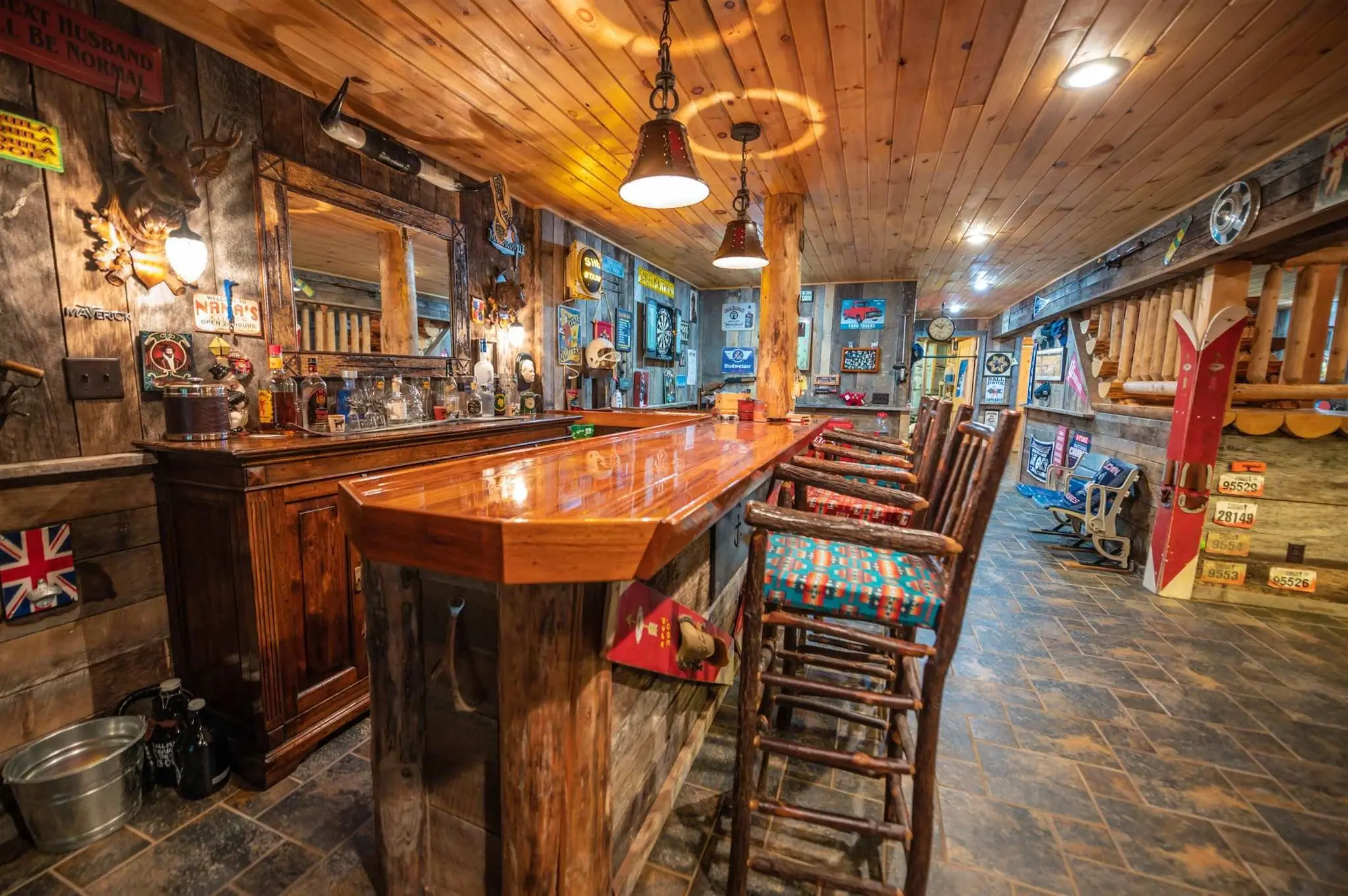 Vintage decor and industrial lighting bring a lively personality to the game room and bar. 