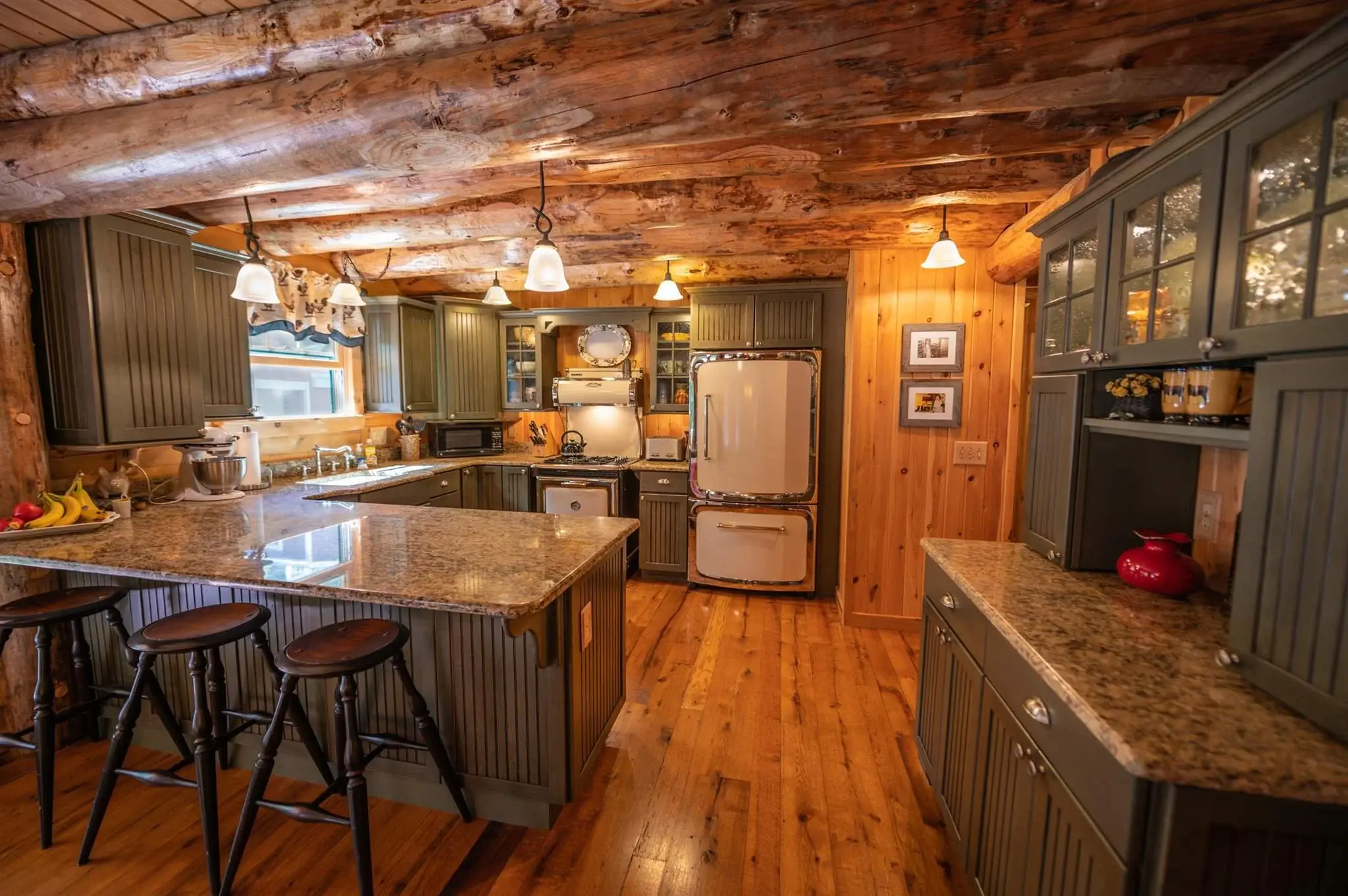 With plenty of counter space and ample storage, the kitchen is thoughtfully designed for practicality, while the vintage-inspired appliances tie in the nostalgic decor of the rest of the home.