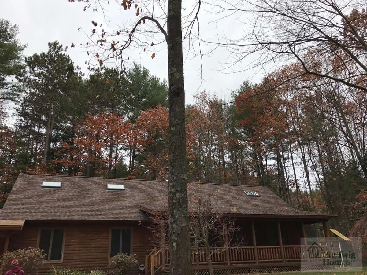 A log home in the woods for the Pritchard family built by Big Twig Homes.