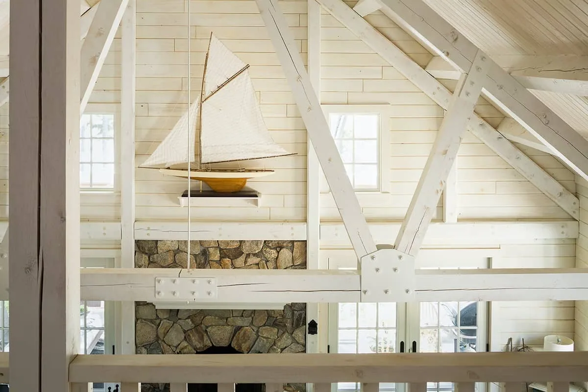 A vaulted ceiling with painted wooden timbers.
