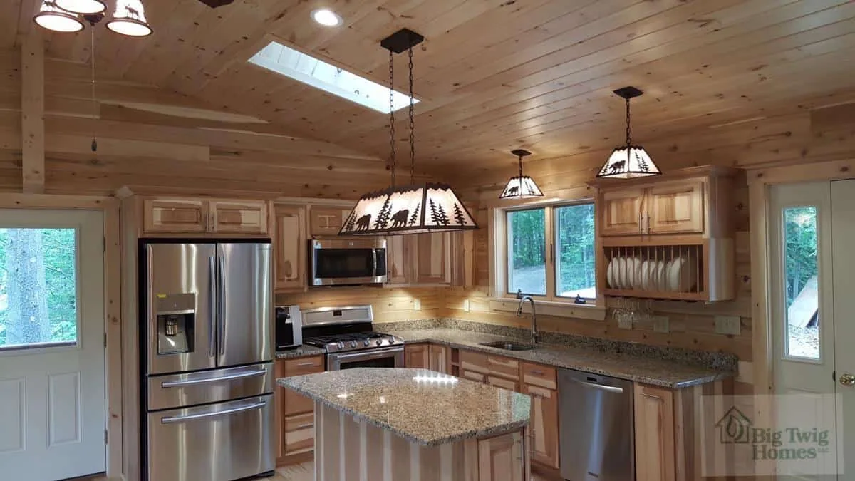 Beautiful lighting in a custom kitchen from Big Twig homes.